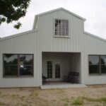 Image of galvanized steel barndominiums in Sweetwater Ranch, Arizona, showcasing modern design and rural charm