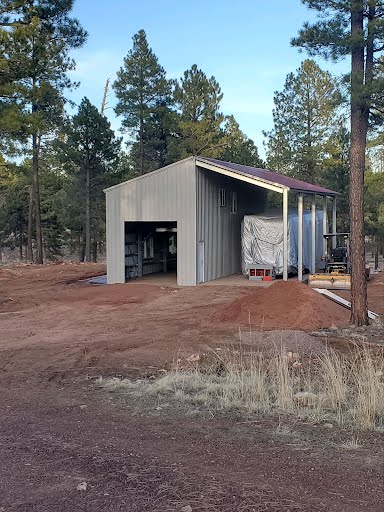 Modern galvanized steel cabins in Fortuna Foothills, Arizona, showcasing durability and contemporary design against a scenic backdrop