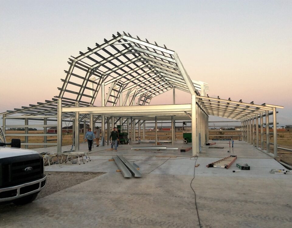 Exterior view of galvanized steel barndominiums in Saddle Brooke, Arizona showcasing modern design and rustic charm