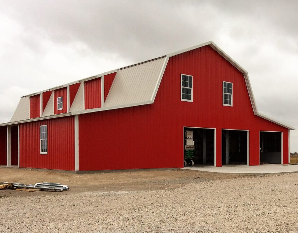 Stunning galvanized steel barndominiums in Sun City, Arizona, showcasing modern design and desert landscape harmony