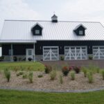 Modern galvanized steel barndominiums in Warren, Arizona, showcasing durable design and rural charm